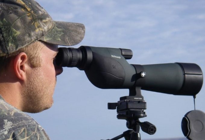 Man-using-spotting-scope