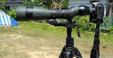Spotting scope mounted on camera