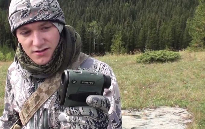 man holding vortex rangefinder