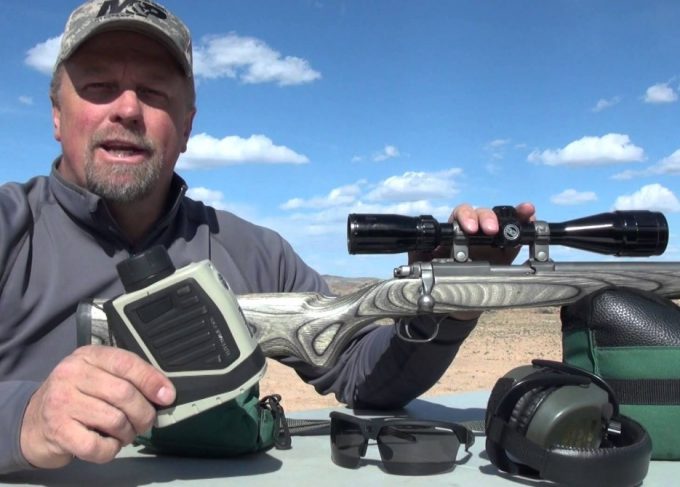 man with bushnell rangefinder