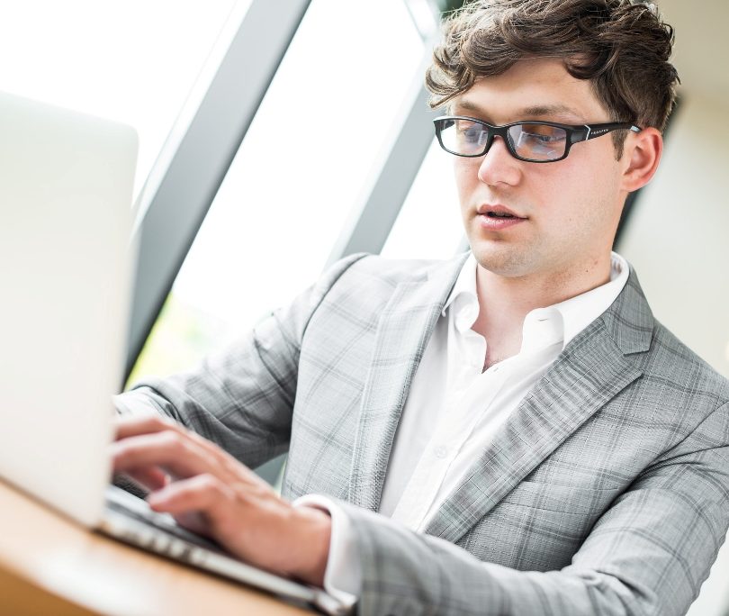 Man is Working With Computer Glasses